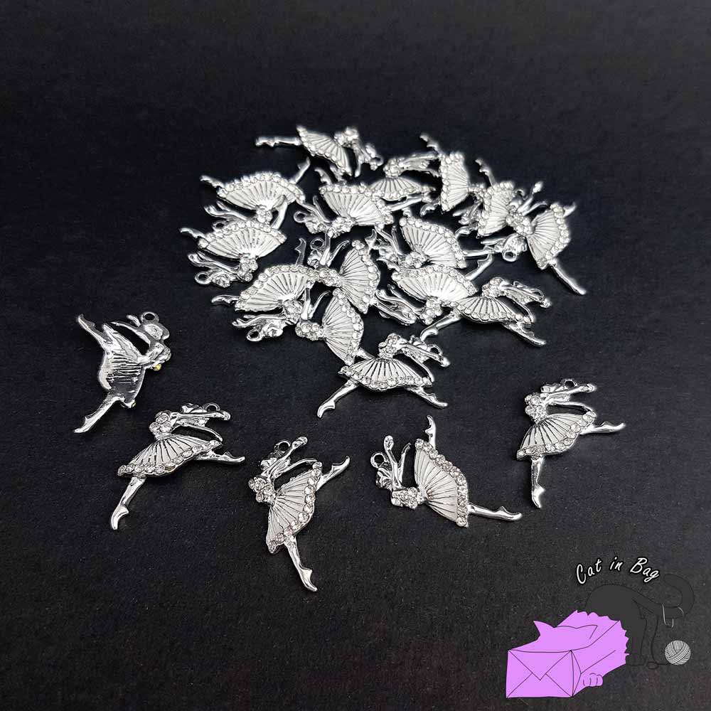 2 charms with white ballerina