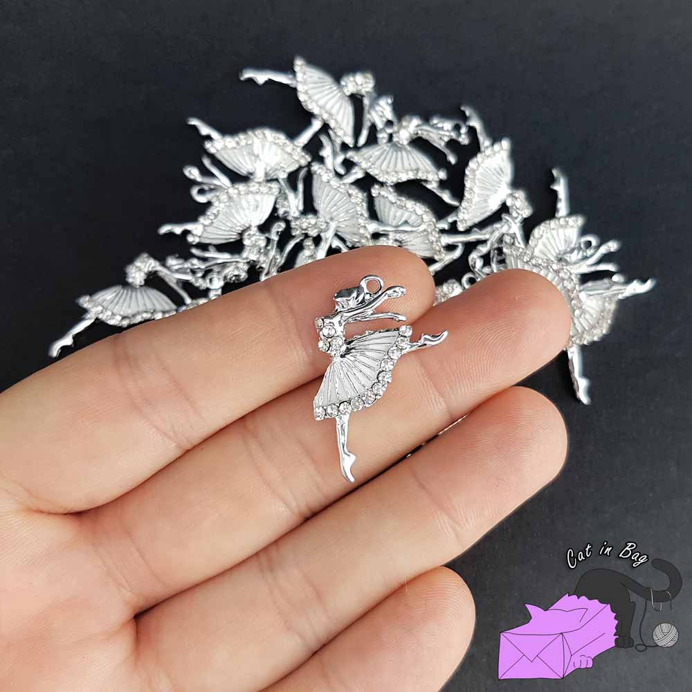 2 charms with white ballerina