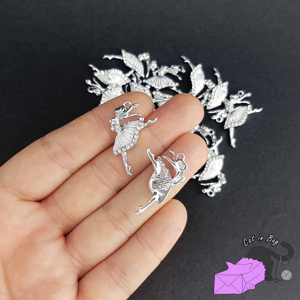 2 charms with white ballerina