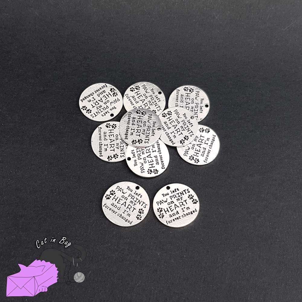 1 charm with words "you left paw print on my heart and I'm forever changed"
