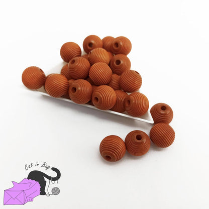 10 perle rigate in legno color nocciola